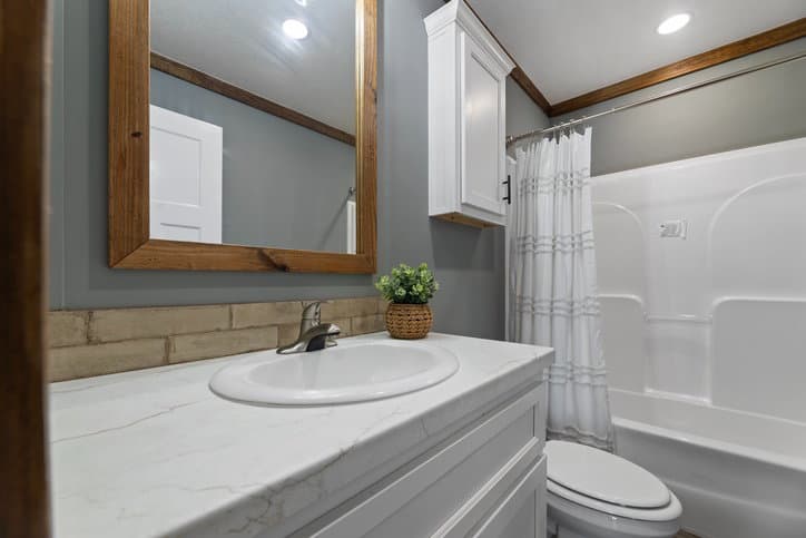 The reece by cavco moultrie bathroom home features